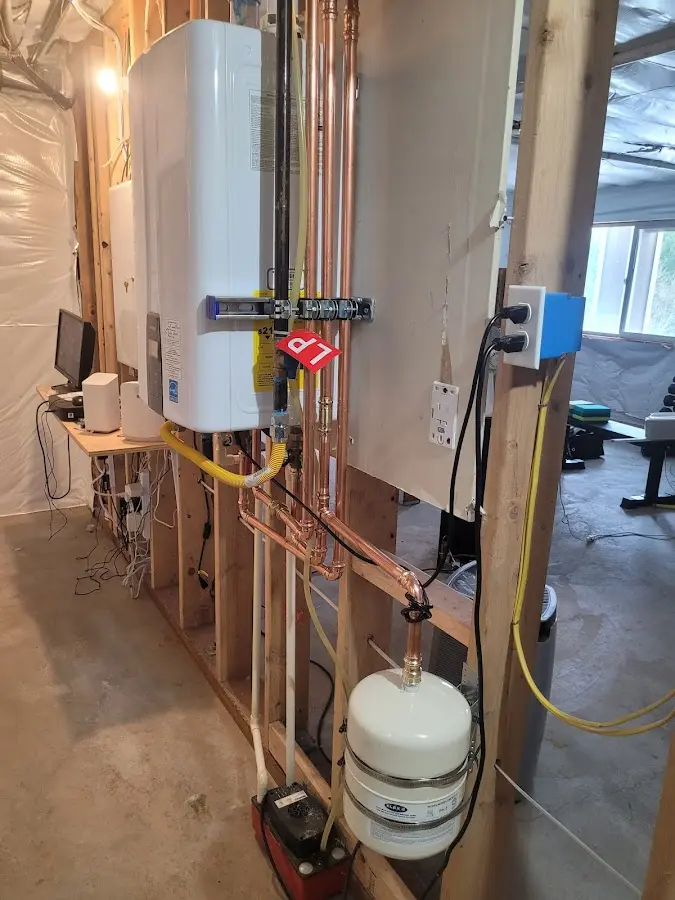 Licensed plumber repairing a kitchen sink in Moon